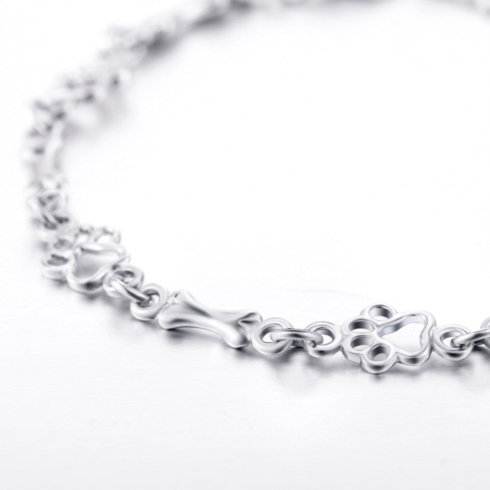 Βραχιόλι Limited Edition από Καθαρό Ασήμι με Charms Πατουσάκι και Κοκαλάκι